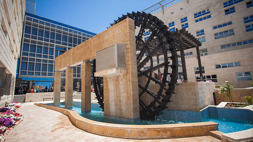 A water wheel in a courtyard at the German Jordanian University